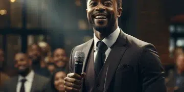 afrikhepri a confident black man speaking in a conference with 2bcce7e3 ff6a 4c68 a9e4 aea15c305070 1
